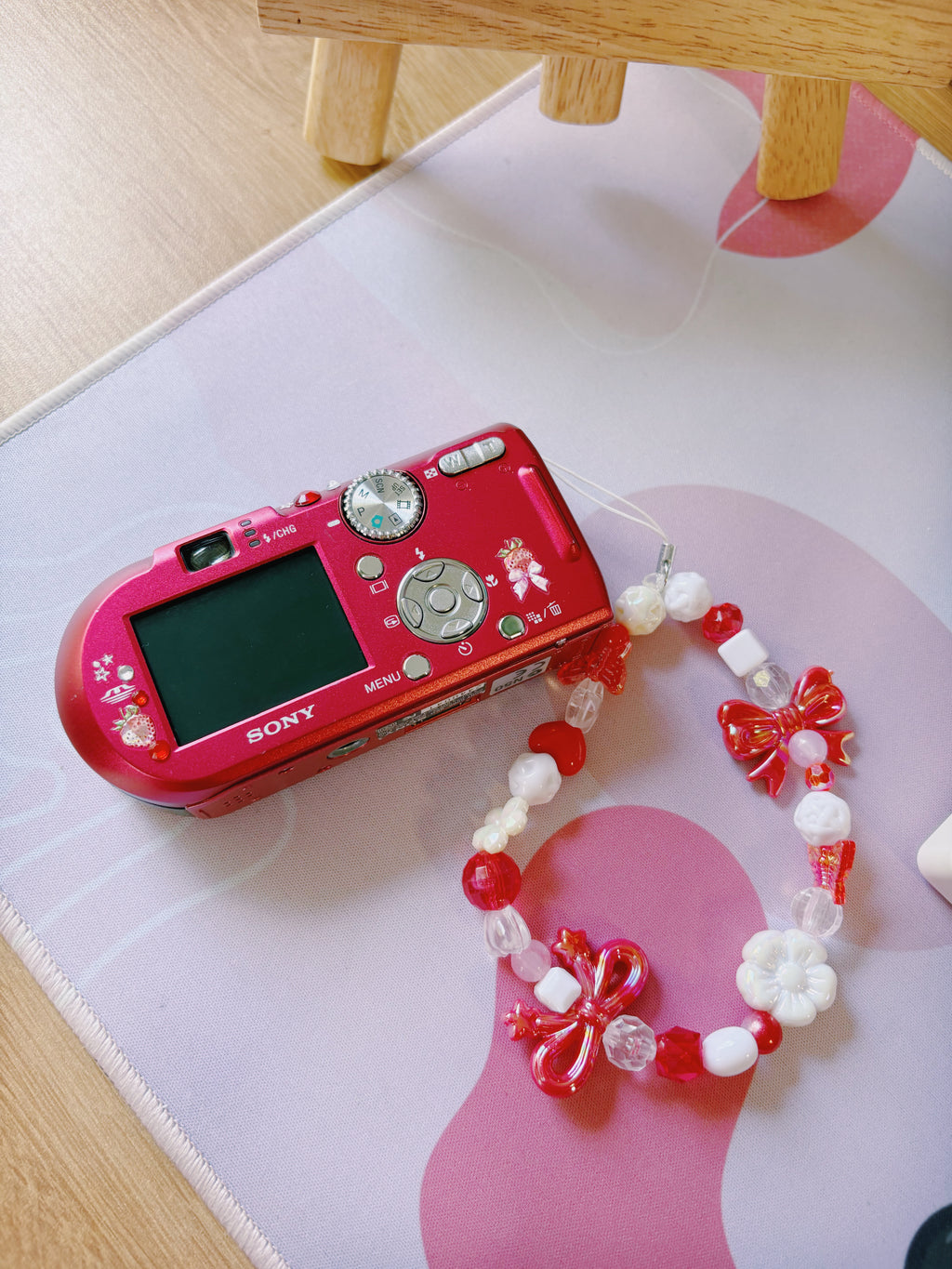 Scarlet – The Statement Maker | Sony Cyber-shot DSC-T100 – Red