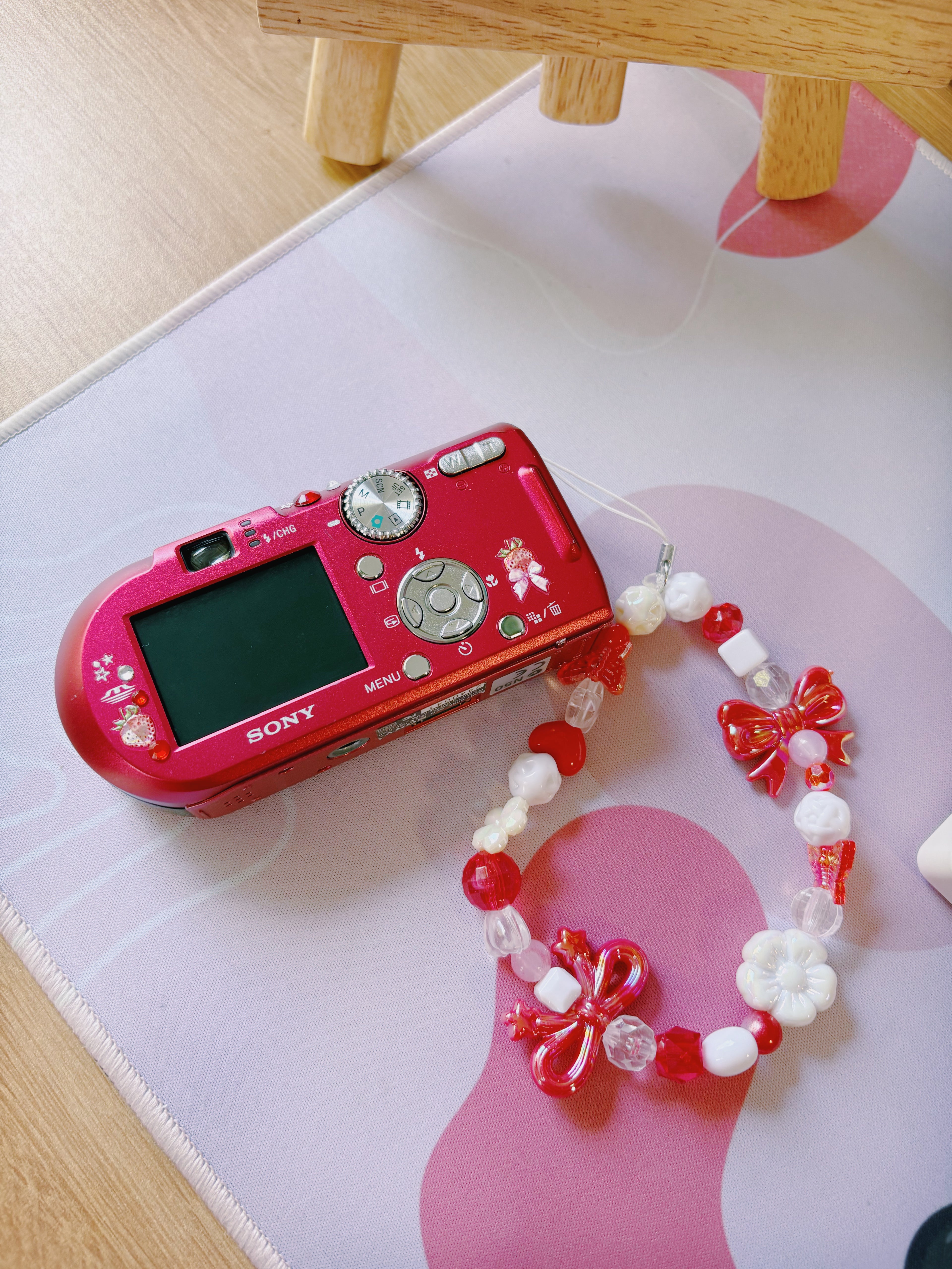 Scarlet – The Statement Maker | Sony Cyber-shot DSC-T100 – Red