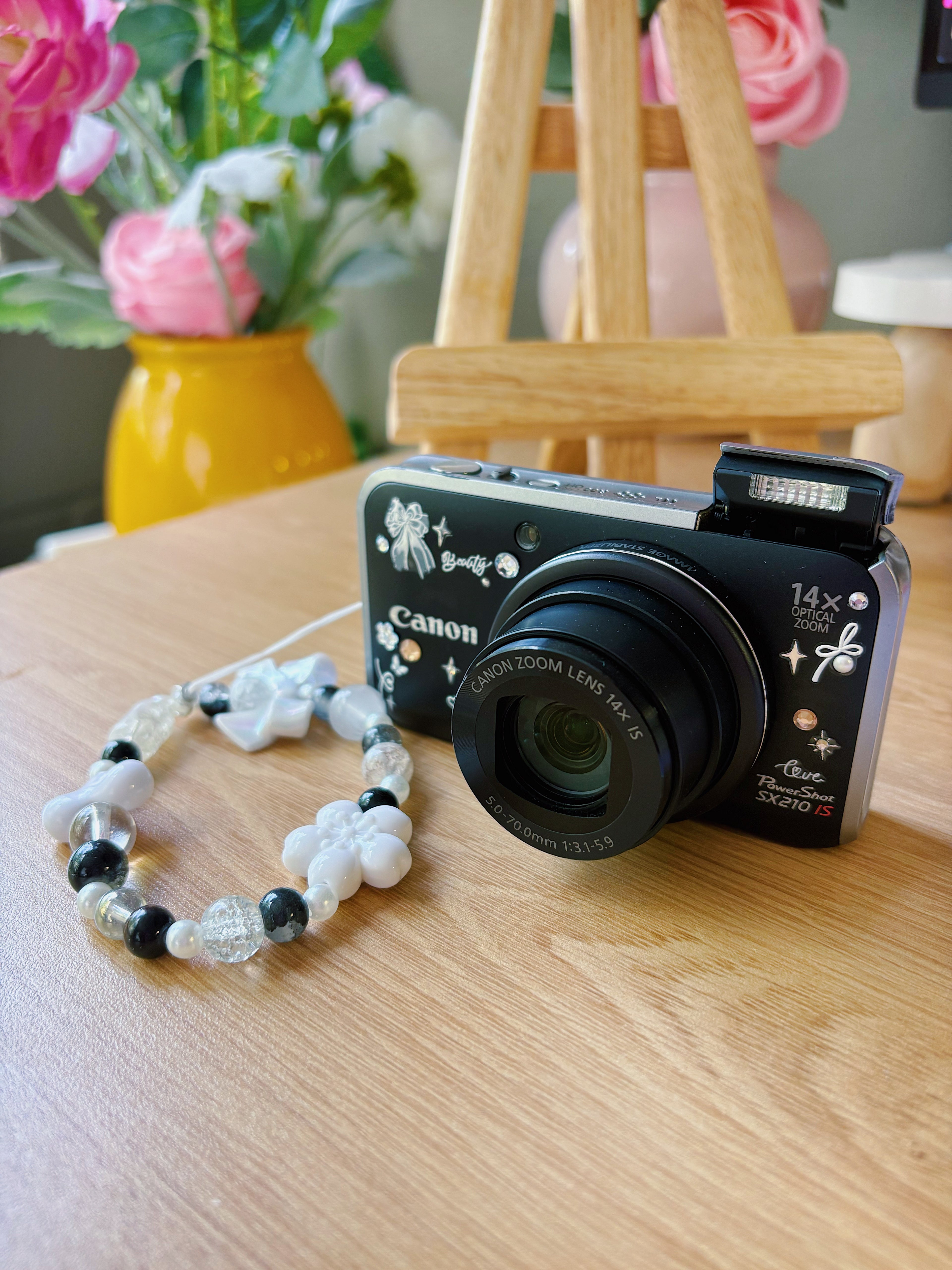 Noir – The Midnight Muse | Canon PowerShot SX210HS – Black